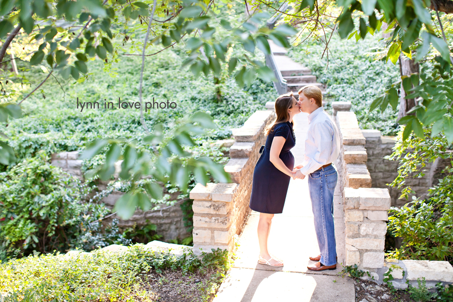 Couple kissing on bridge