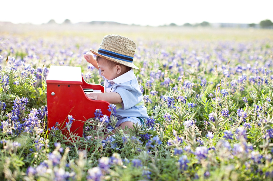 Lynn in Love Photo, Dallas Baby Photographer with red piano in bluebonnet field