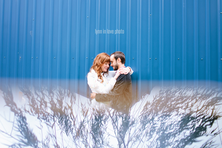 Fershop Houston Workshop with engagement pictures with blue wall and reflection by Lynn in Love Photo, Dallas Wedding Photographer