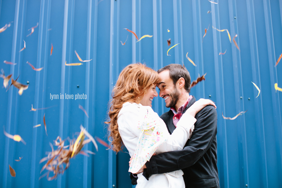 Fershop Houston Workshop with engagement pictures with blue wall and falling leaves by Lynn in Love Photo, Dallas Wedding Photographer
