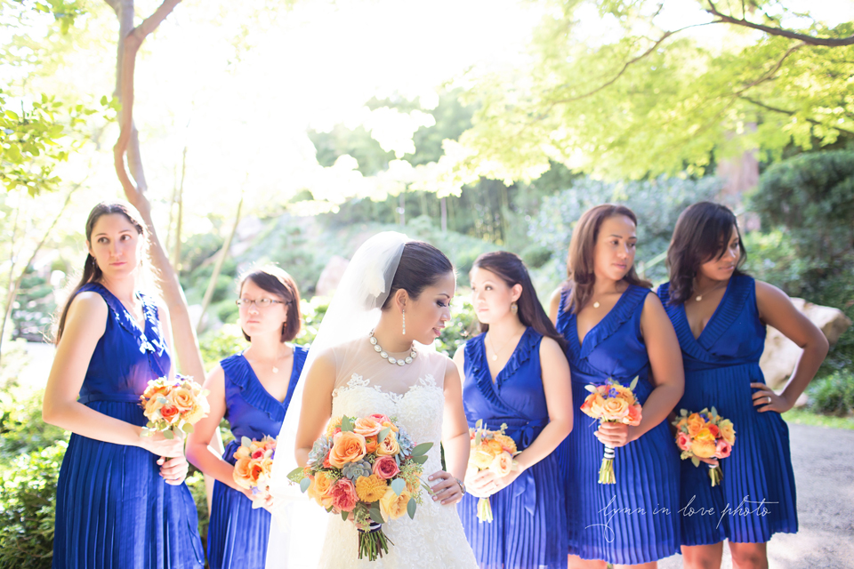 Lanchi and Todd's Rice University and Denver Bronco themed wedding with colorful details like these gorgeous bouquet wrapped in blue and white gingham ribbon and beautiful bridal party in blue dresses at the Ft. Worth Japanese Gardens by Lynn in Love Photo, Dallas Wedding Photographer