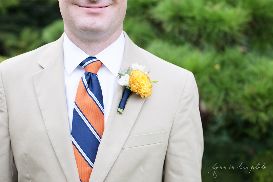 Lanchi and Todd's Rice University and Denver Bronco themed wedding with colorful details like these boutonniere and owl details in blue dresses at the Ft. Worth Japanese Gardens by Lynn in Love Photo, Dallas Wedding Photographer