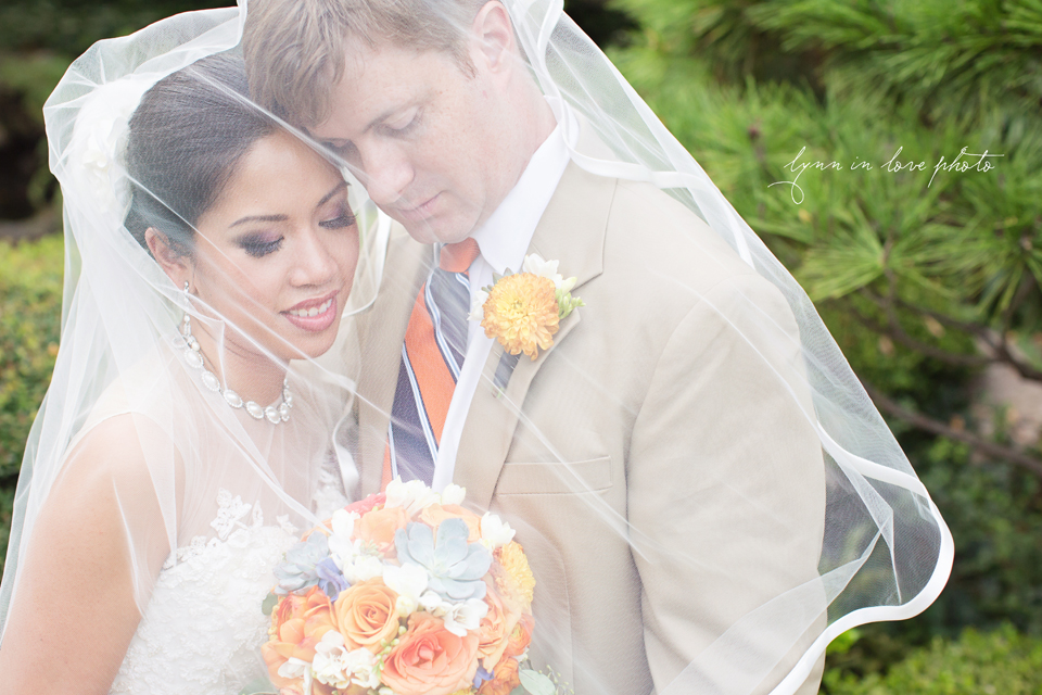 Lanchi and Todd's Rice University and Denver Bronco themed wedding with colorful details  and romantics bride and groom Day After Portraits with veil details at the Ft. Worth Japanese Gardens by Lynn in Love Photo, Dallas Wedding Photographer