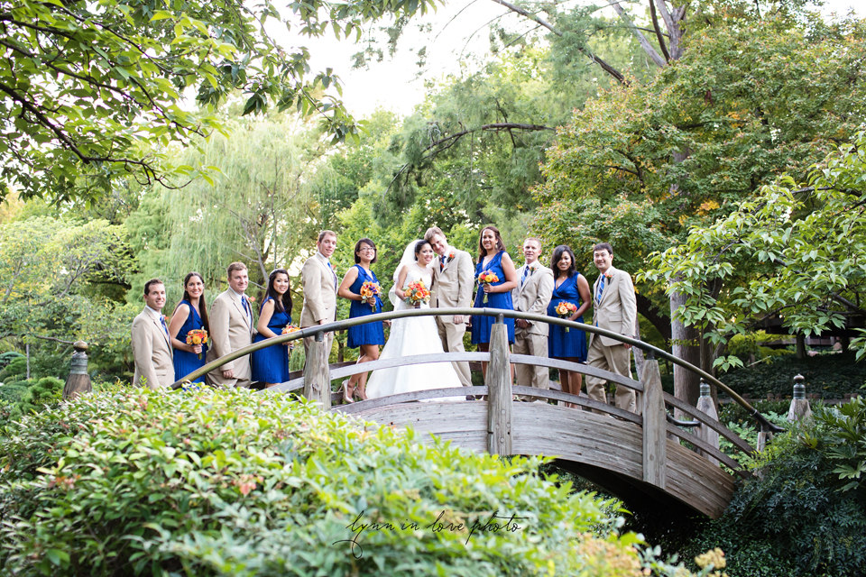 Lanchi and Todd's Rice University and Denver Bronco themed wedding with colorful details with bridal party pictures at the Moon Bridge at Ft. Worth Japanese Gardens by Lynn in Love Photo, Dallas Wedding Photographer