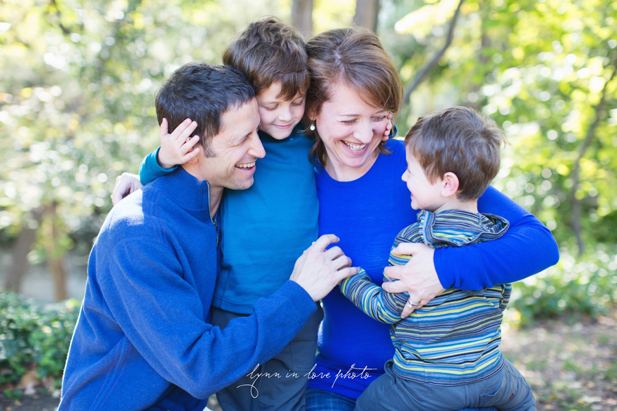 sweet moment with family hugging in the blue sweaters by Lynn in Love Photo, Dallas and Houston Family Photographer