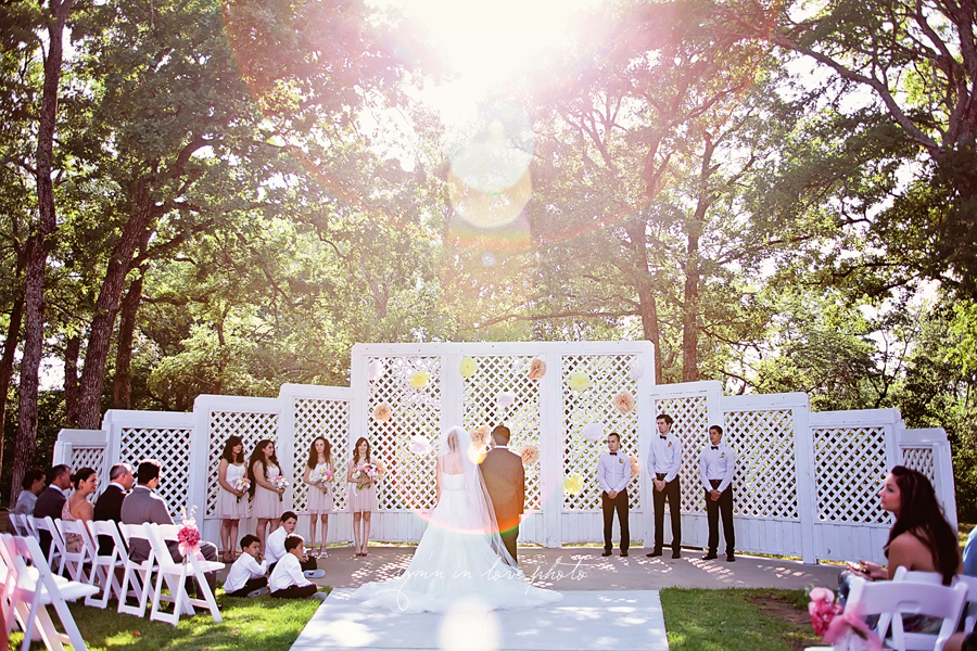  Outdoor wedding ceremony with sun flare by Lynn in Love Photo, Dallas and Houston Wedding Photographer