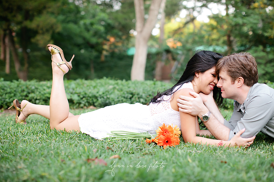 Fun engagement session in park and orange gerber daisy by Lynn in Love Photo, Dallas and Houston Wedding Photographer
