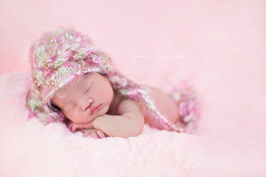 Adorable girl newborn session with pink knit hat and blanket by Lynn in Love Photo, Dallas and Houston Newborn Photographer