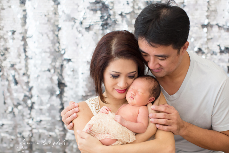 Family protrait with newborn and shimmery background by Lynn in Love Photo, Dallas and Houston Newborn Photographer