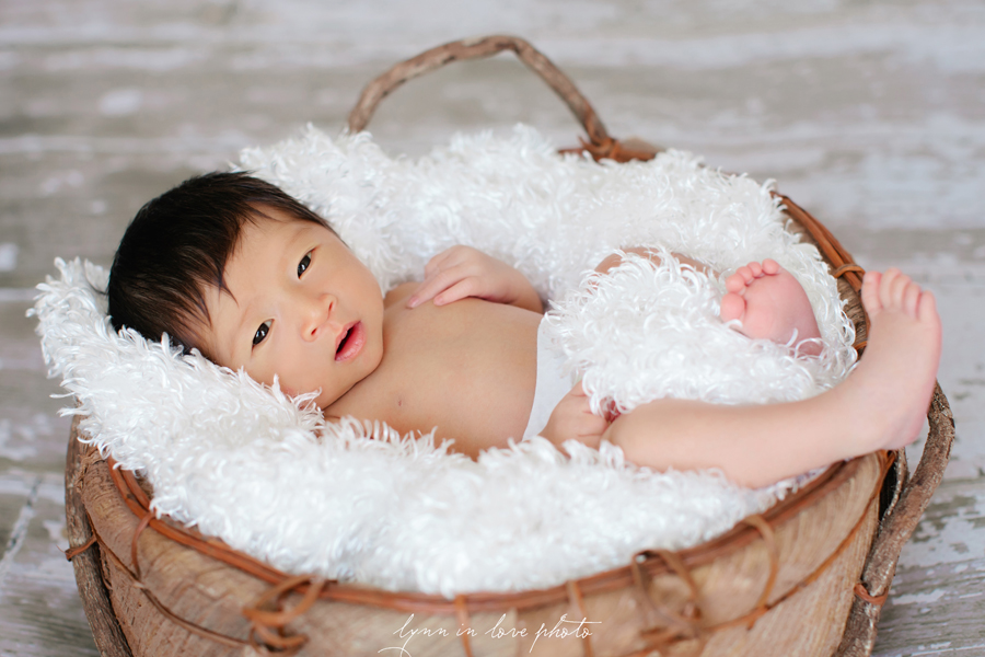 asian newborn baby in organic basket by Lynn in Love Photo, Dallas and Houston Newborn Photographer